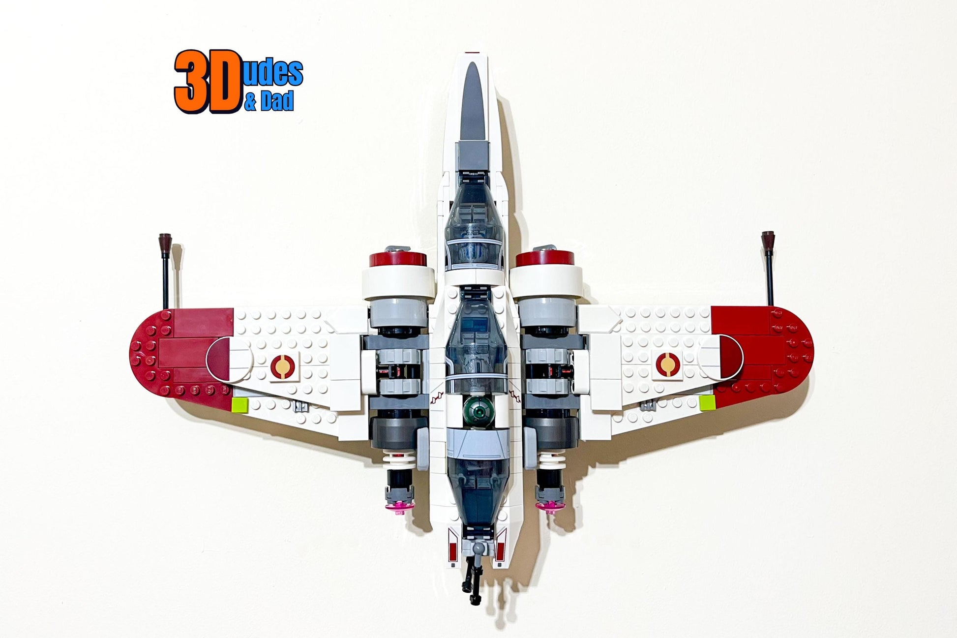 Front-facing view of LEGO Star Wars ARC-170 Starfighter (set 75402) mounted on a wall using a 3Dudes & Dad display bracket.