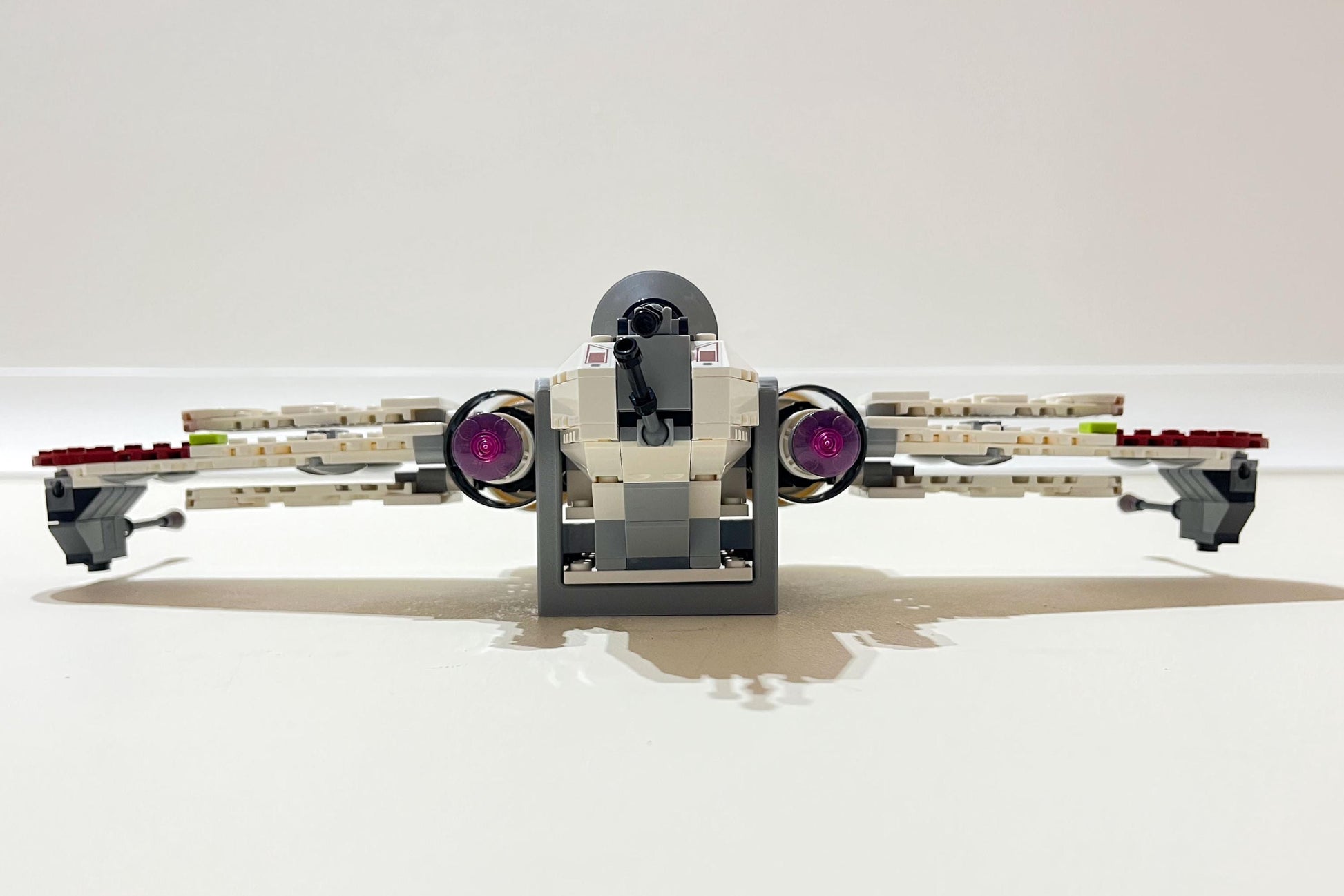 Underside view of LEGO Star Wars ARC-170 Starfighter (set 75402) mounted on a study wall using a 3Dudes & Dad display bracket